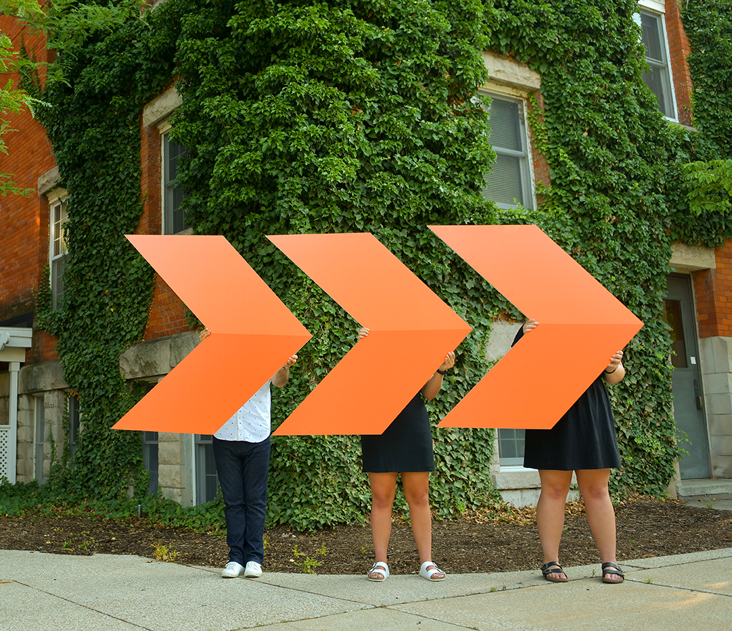 People holding Hope Forward arrows on campus