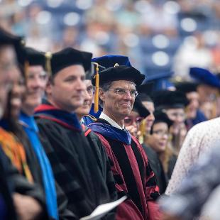 Photo of faculty members attending commencement. 