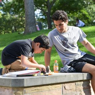 A CASA student and mentor working outside
