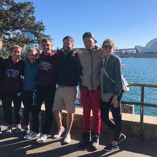 Hope College dance students at the harbor in Sydney, Australia, with the opera house behind them
