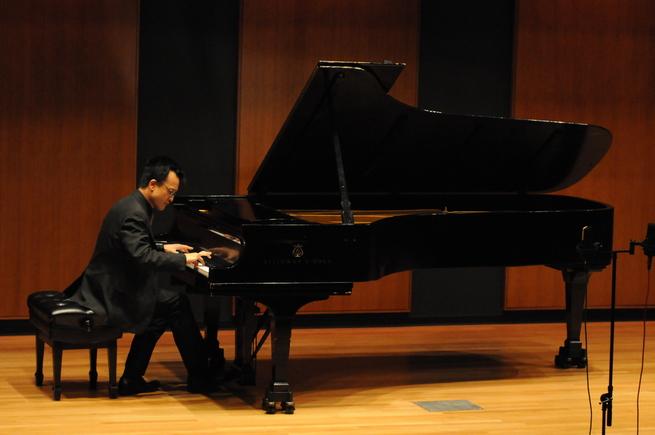 Dr. Andrew Le performing in Inaugural Recital